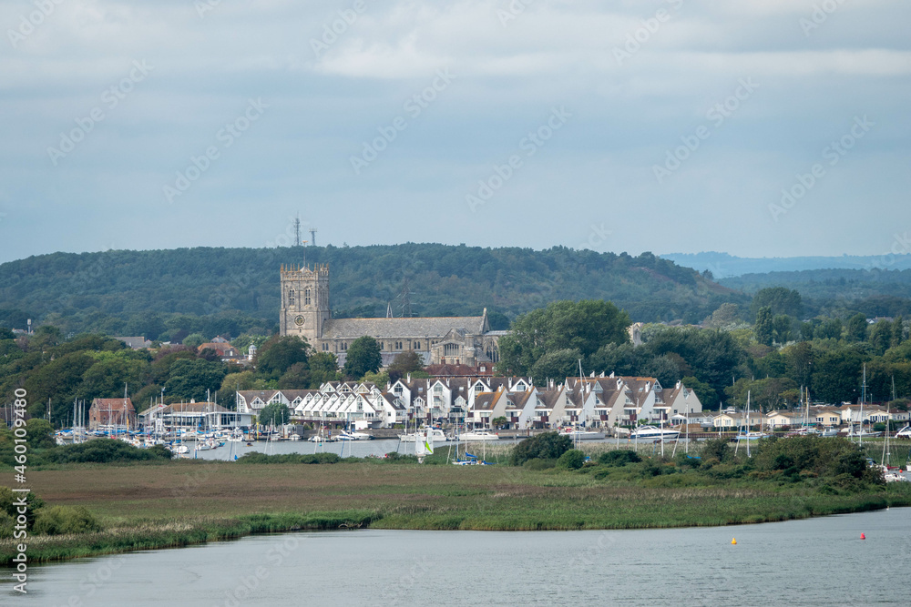 View of Christchurch Priory Dorset England from across the river