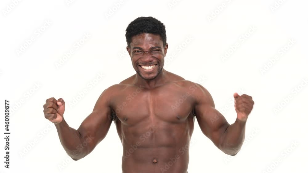 Portrait of a muscular black man excited. Isolated on a white background. Portrait of a muscular black man excited. Isolated on a white background.