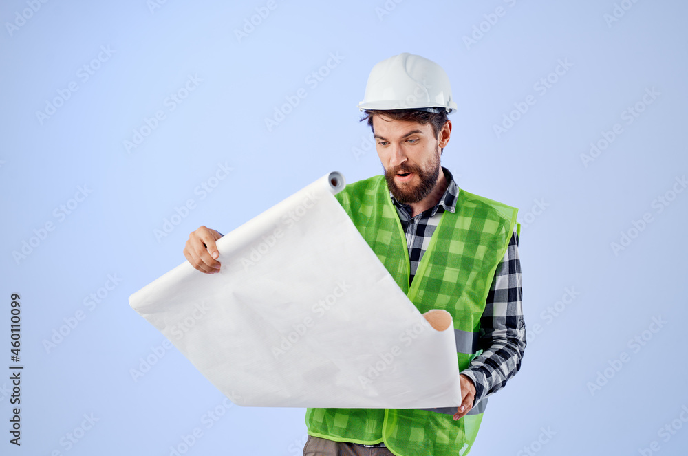 engineer in a white helmet blueprints Professional isolated background engineer in a white helmet blueprints Professional isolated background