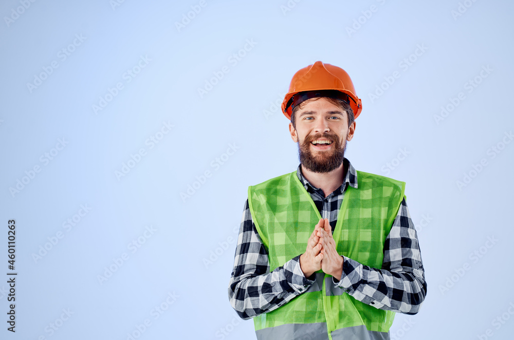 emotional man in orange hard hat construction professional blue background emotional man in orange hard hat construction professional blue background