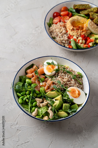 Hummus buddha bowls with quinoa and hard boiled egg, vegetarian restaurant menu, modern simple concept