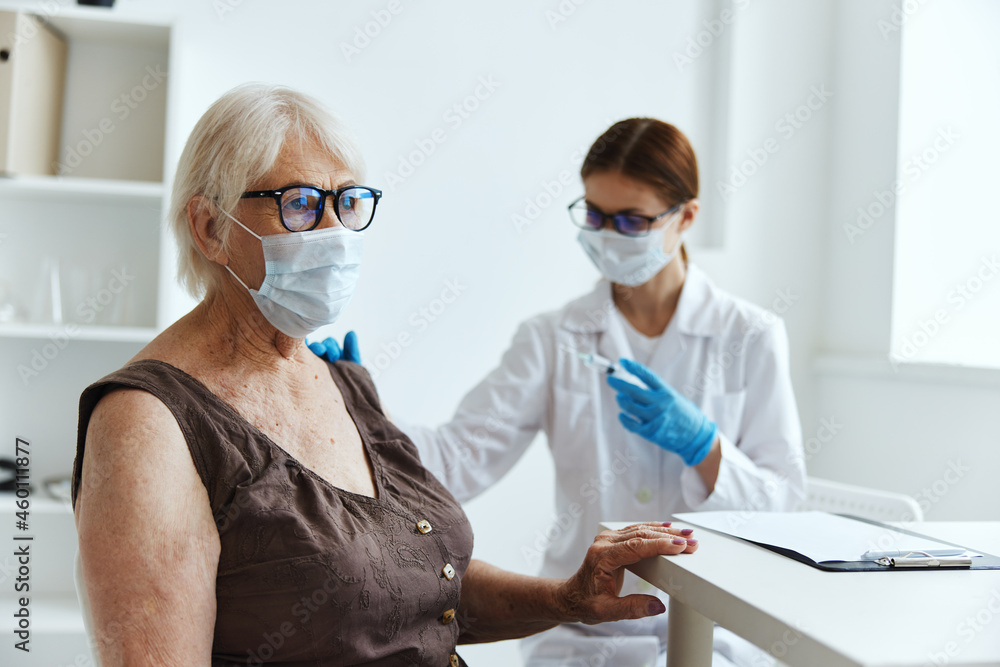 doctor with a syringe makes an injection in the arm immunization safety vaccine passport doctor with a syringe makes an injection in the arm immunization safety vaccine passport