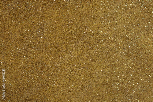 Yellow surface with sequins, use for background.