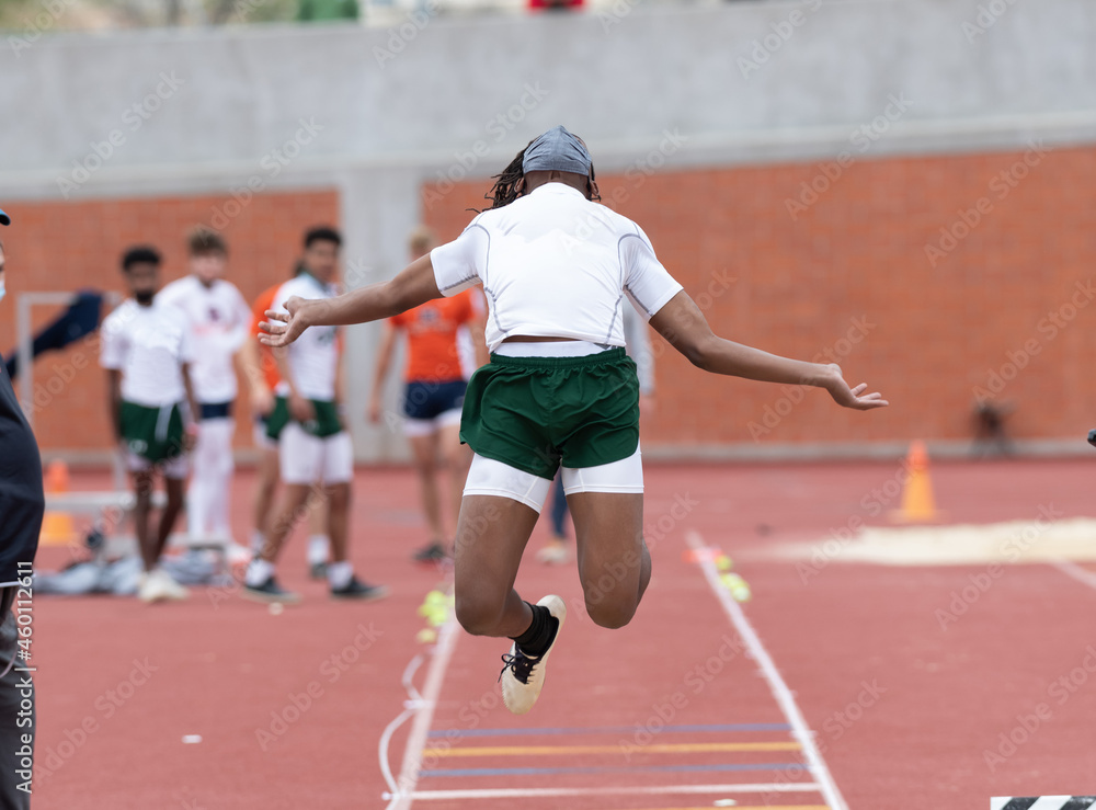 Long jumpers competing at a track and field meet