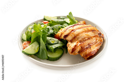 Healthy food, low carb diet. Grilled chicken meat and fresh salad in a plate, isolated on white, top view
