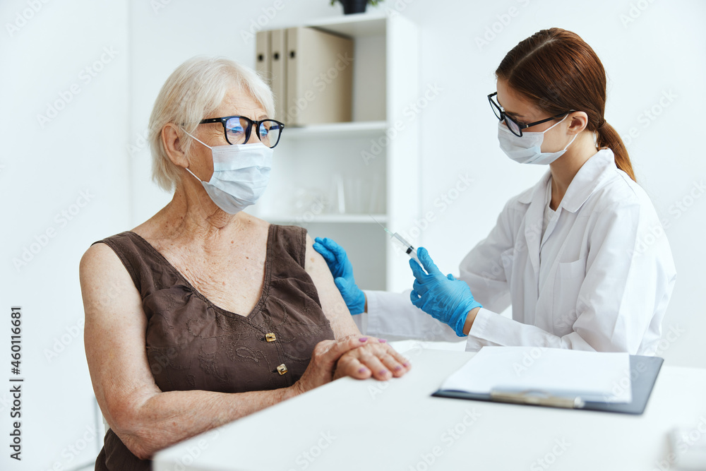 female doctor makes an injection in the arm immunity protection covid passport female doctor makes an injection in the arm immunity protection covid passport