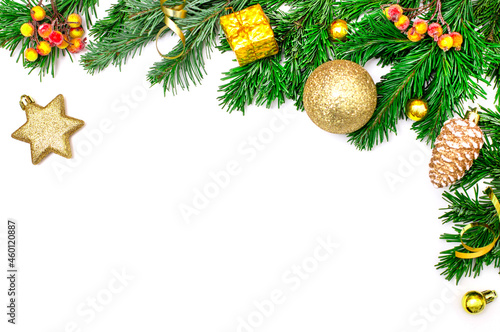 Christmas border isolated on white background. Christmas decor in the form of green spruce branches, yellow balls, cones, stars. Festive concept. Mockup