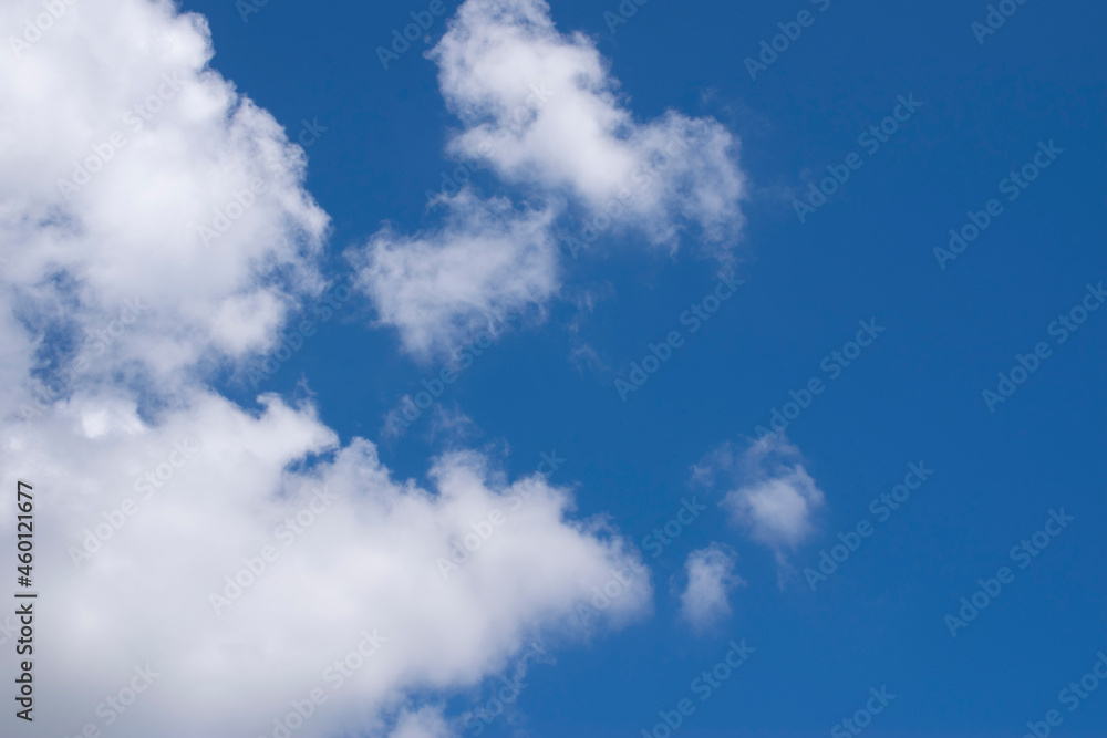 White clouds against a blue sky. Good daylight weather copy space for text White clouds against a blue sky. Good daylight weather copy space for text