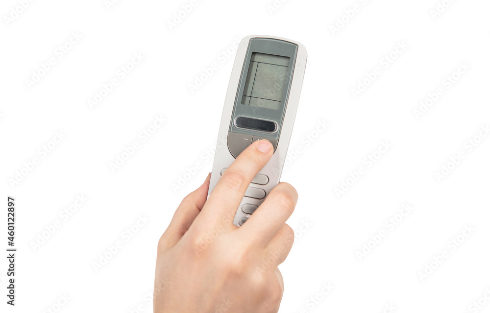 hand pressing button on remote control isolated on white background. under control. hand pressing button on remote control isolated on white background. under control.