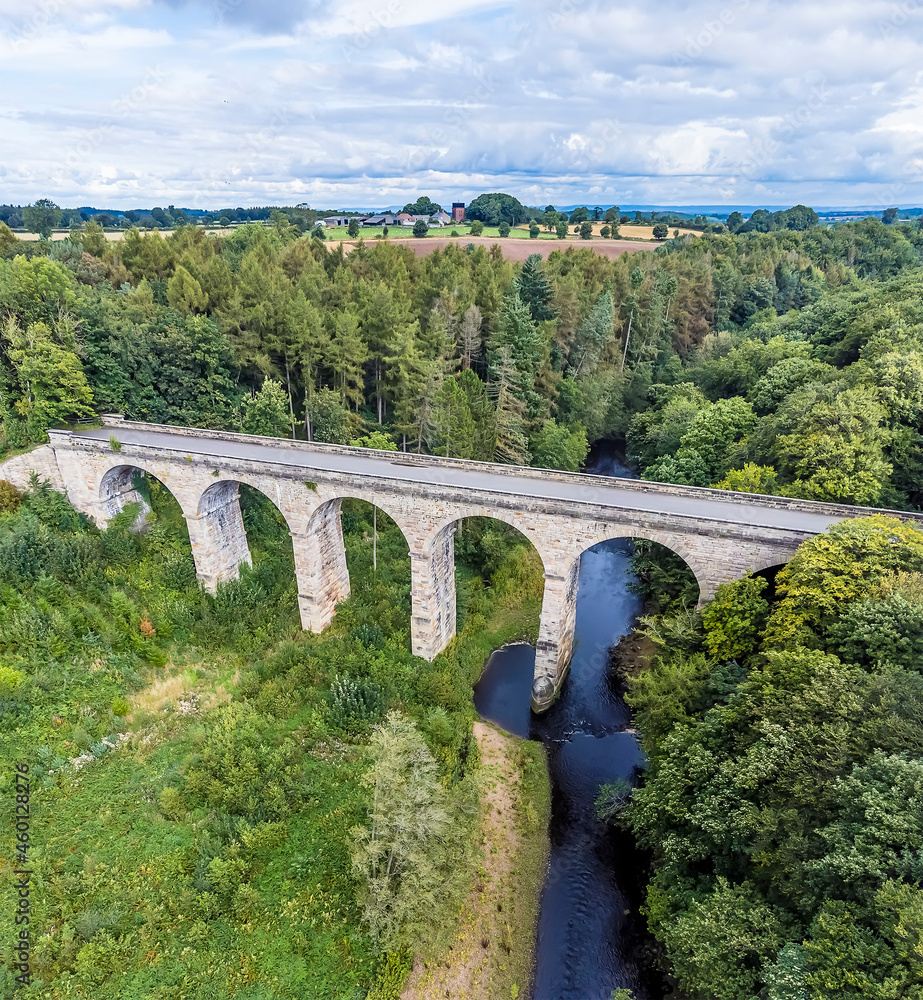 An aerial view along the River Nidd over the Nidd Gorge Viaduct in Yorkshire, UK in summertime An aerial view along the River Nidd over the Nidd Gorge Viaduct in Yorkshire, UK in summertime