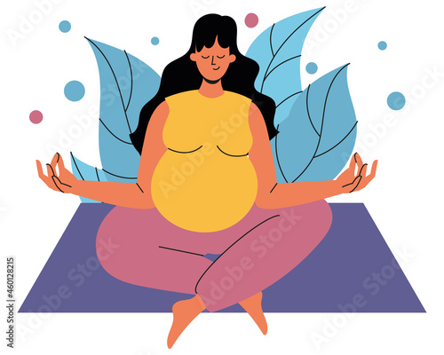 A pregnant woman is sitting on a rug in the lotus position. A pregnant woman is sitting with her eyes closed against the background of foliage. The concept of harmony, tranquility and mental health