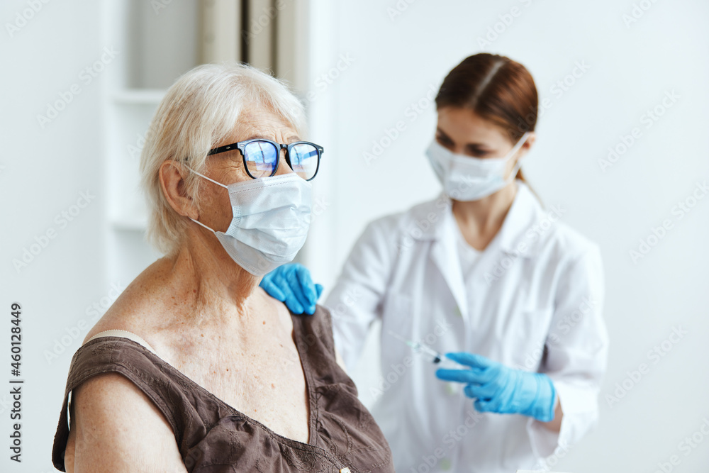 female doctor makes an injection in the arm immunity protection covid passport female doctor makes an injection in the arm immunity protection covid passport