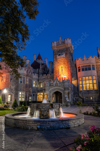 Beautiful Gothic Revival style mansion and fountain at dusk. Toronto Ontario