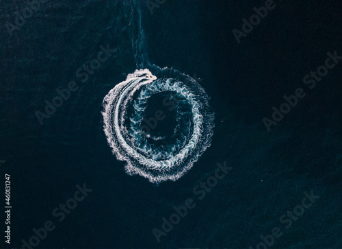 Fényképezés Aerial view of a motorboat sailing on the sea and making splashes