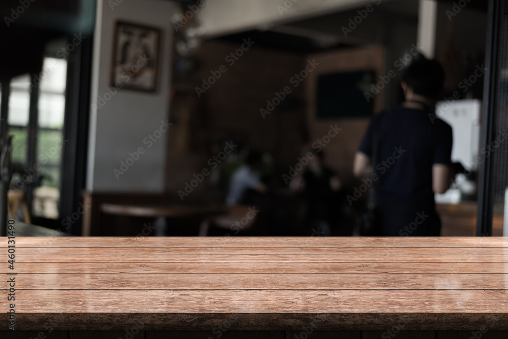 Empty wooden table top with lights bokeh on blur restaurant background. Empty wooden table top with lights bokeh on blur restaurant background.