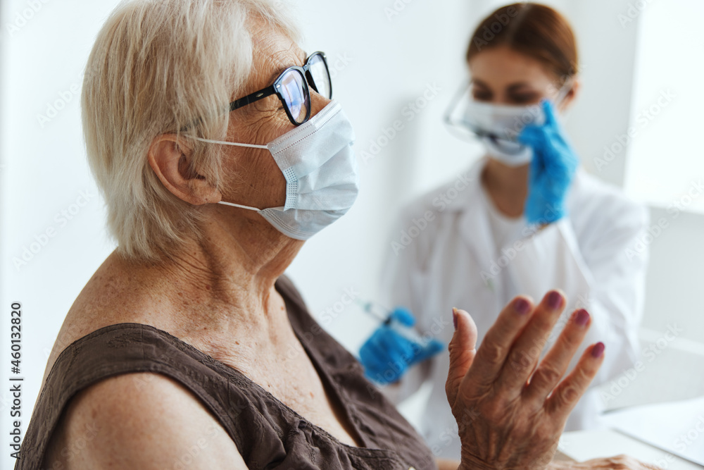 elderly woman wearing a medical mask immunization safety health care elderly woman wearing a medical mask immunization safety health care