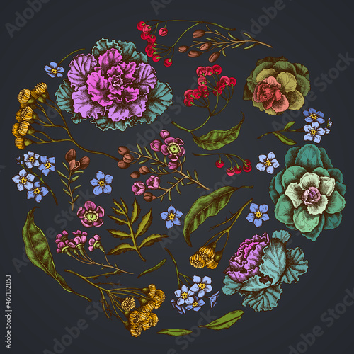 Round floral design on dark background with wax flower, forget me not flower, tansy, ardisia, brassica, decorative cabbage