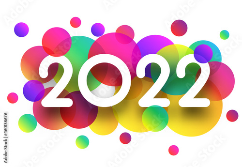 2022 white sign over colourful confetti.