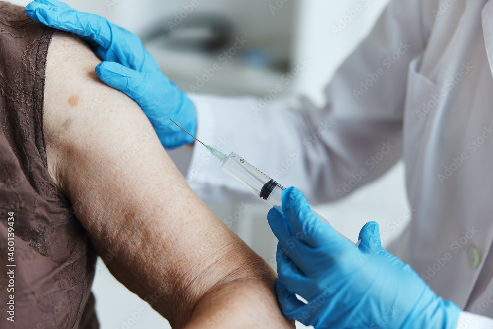 doctor shoulder injection vaccine passport close-up doctor shoulder injection vaccine passport close-up