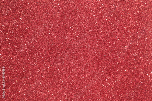 Red surface with glitter, use for background. 