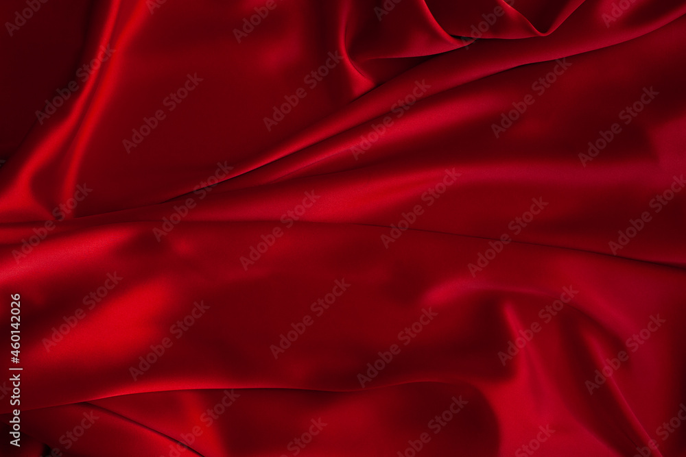 Obraz premium Red fabric texture background. Silk satin folds