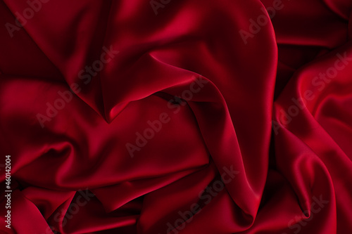 Red smooth cloth folds texture background