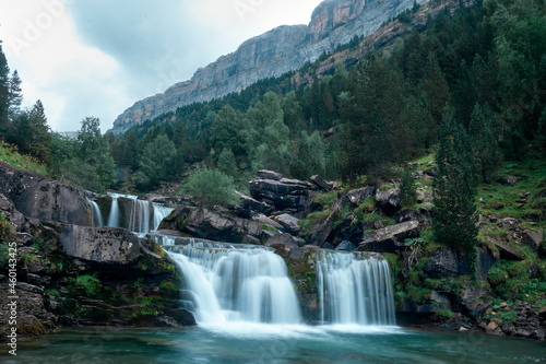 The waterfalls of the Gradas de Soaso of the Arazas river in the National Park of Ordesa and Monte Perdido in the Pyrenees of Huesca. Aragon. Spain photo