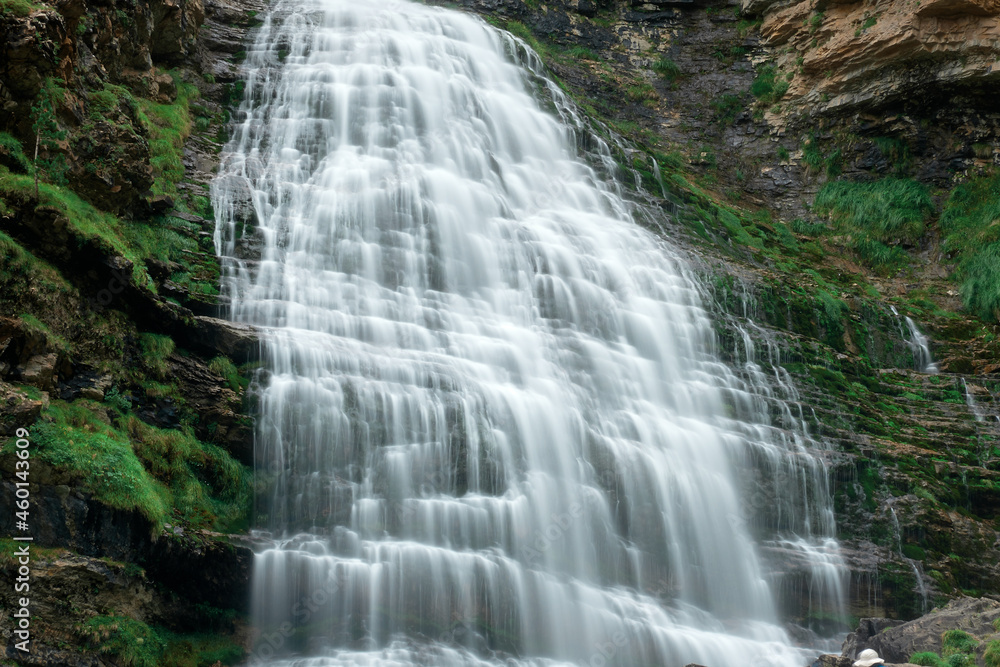 Fototapeta premium Large waterfall at the end of the Cola de Caballo route in Ordesa, Pyrenees Aragon Huesca Spain
