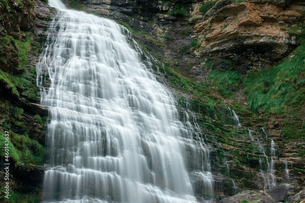 Fototapeta premium Cola de Caballo waterfall under Monte Perdido in the Ordesa Valley, Pyrenees of Spain.