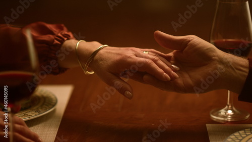 Senior love couple hands touching each other in restaurant. Family relationship