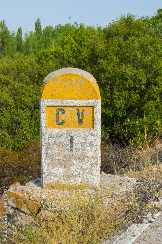 spanish stone mileposts in a antique road without service spanish stone mileposts in a antique road without service