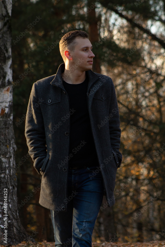 a man walking in the autumn forest a man walking in the autumn forest