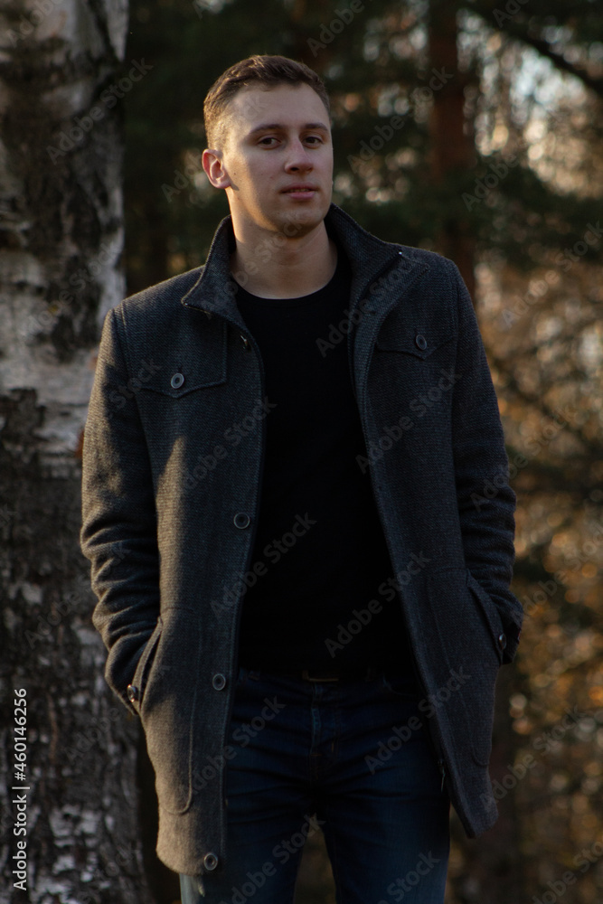 a man walking in the autumn forest a man walking in the autumn forest