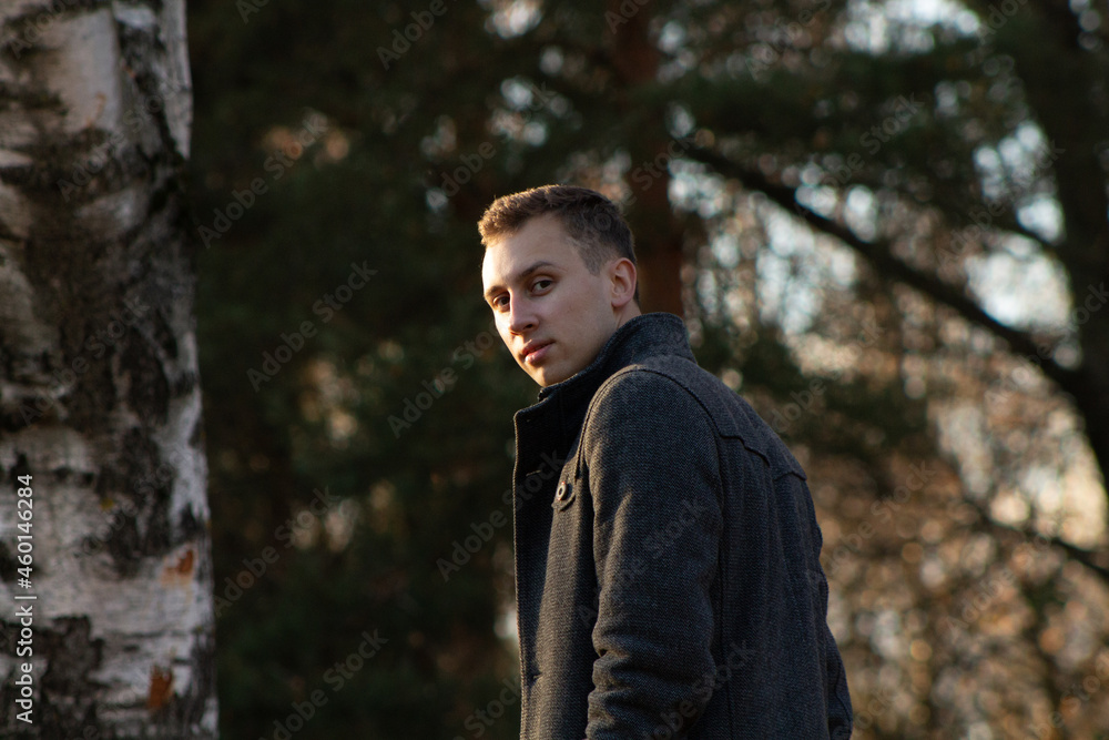 a man walking in the autumn forest