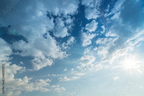 Blue Sky with Sun Shining and Clouds