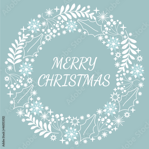 MErry christmas text in wreath made from ornaments in blue and white colors.Winter holidays concept.POstcard