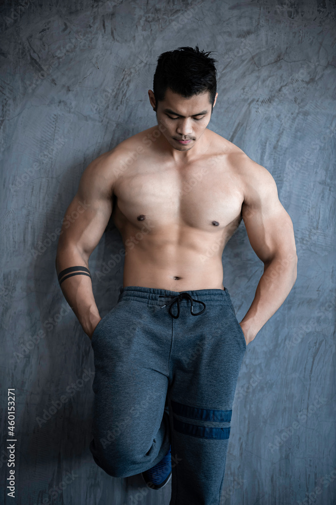 Portrait of asian man big muscle at the gym,Thailand people,Workout for good healthy,Body weight training,Fitness at the gym concept