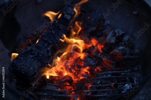 Barbecue flaming Charcoal Grill close up photo. Cooking outdoor. Beautiful flames of fire. 