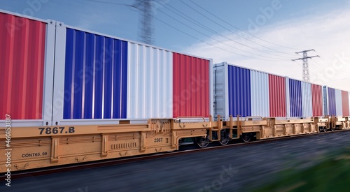 French export. Running train loaded with containers with the flag of France. 