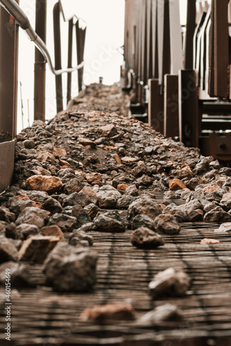 Industrial conveyor belt for the transfer of raw materials from the mine. Mineral processing in the iron ore mining industry.