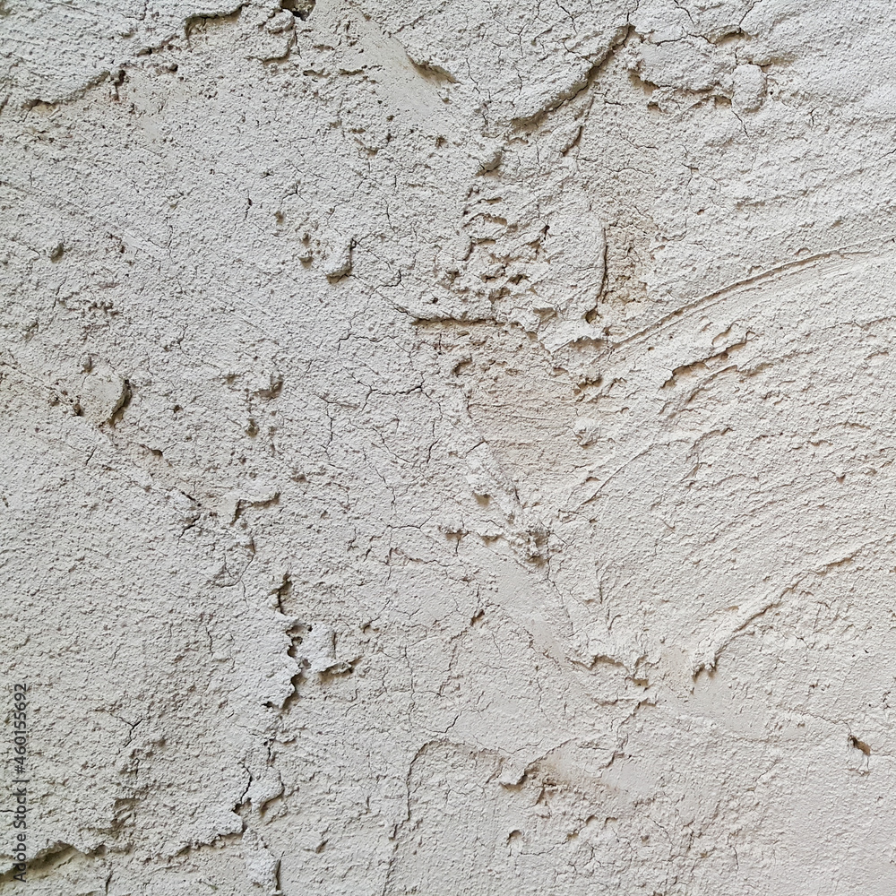 The plastered wall is gray. The wall inside the room. Background picture with scratches. Architecture and construction. Interior design. Copy space for text. The plastered wall is gray. The wall inside the room. Background picture with scratches. Architecture and construction. Interior design. Copy space for text.