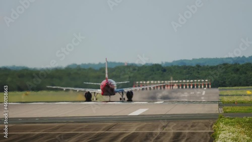 Rear view, airplane taking off photo