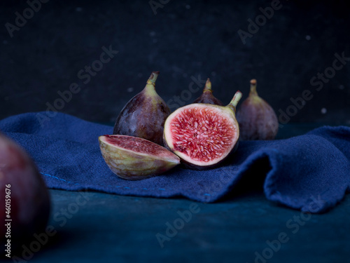 Fresh figs on dark wooden background photo