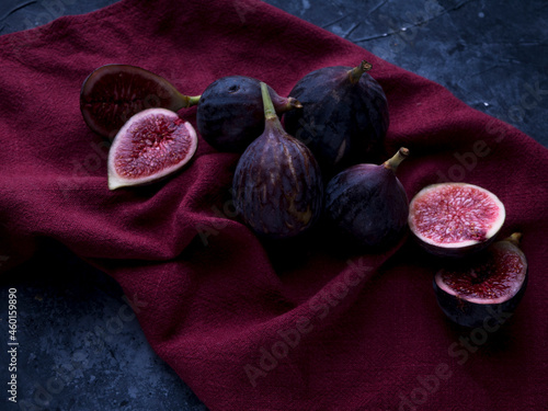 Fresh figs on dark wooden background photo