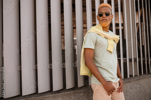 A picture of a dark-skinned stylish man in sunglasses photo