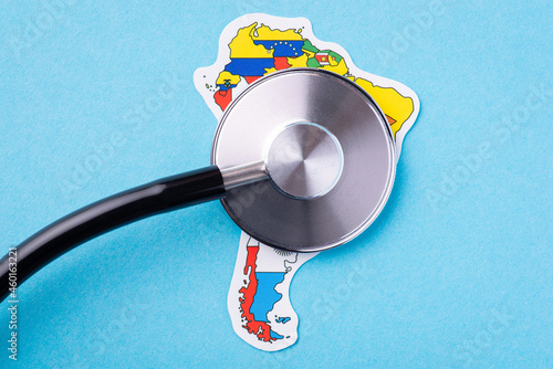 Medical and health care situation on South America continent. Stethoscope on map of South America with flags of each country that locatedon the continent photo