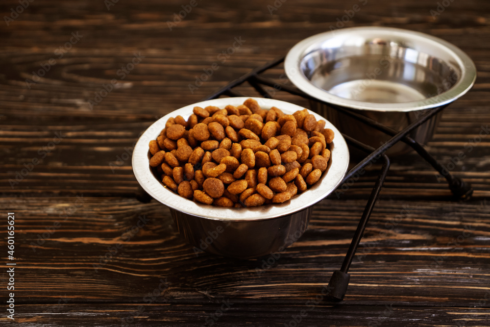dry food for cats on a wooden background dry food for cats on a wooden background