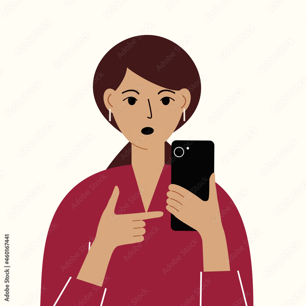 Angry woman with mobile phone, front view. Indicates the phone. News. Smartphone and internet addiction. Angry woman with mobile phone, front view. Indicates the phone. News. Smartphone and internet addiction.