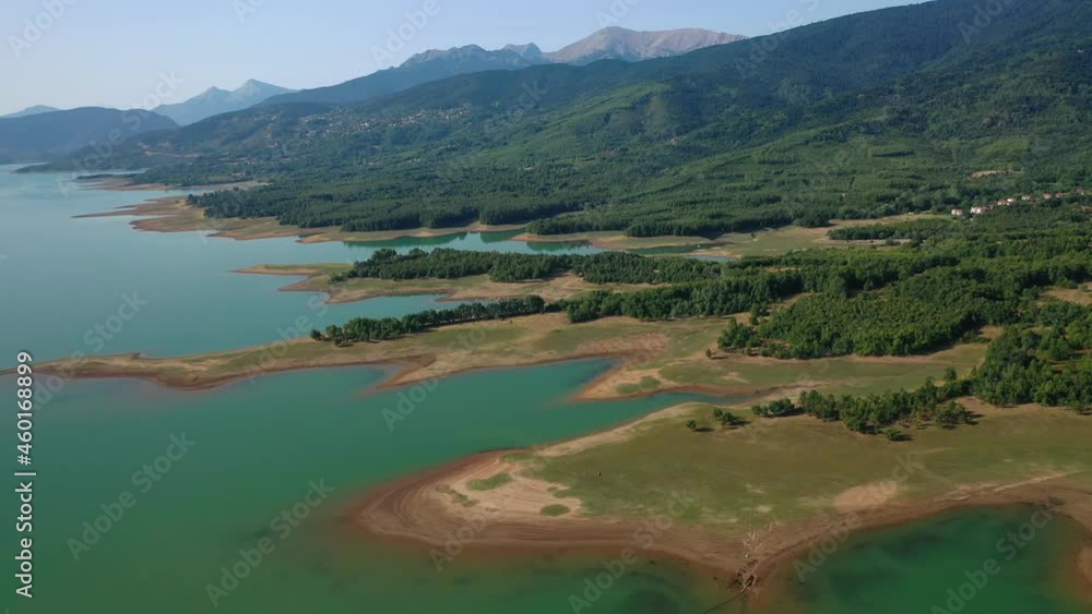 Aerial drone video of beautiful artificial lake with wonderful nature and outdoor and water activities like canoe and water bike Aerial drone video of beautiful artificial lake with wonderful nature and outdoor and water activities like canoe and water bike