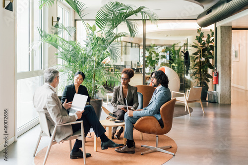 Italy, Business people having meeting in creative studio